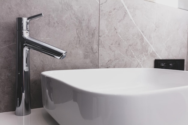 Modern basin and faucet in bathroom