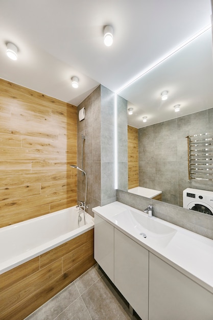 Modern bathroom interior with big stylish mirror. Elements interior of apartment.