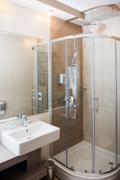 Modern bathroom interior with shower and sink