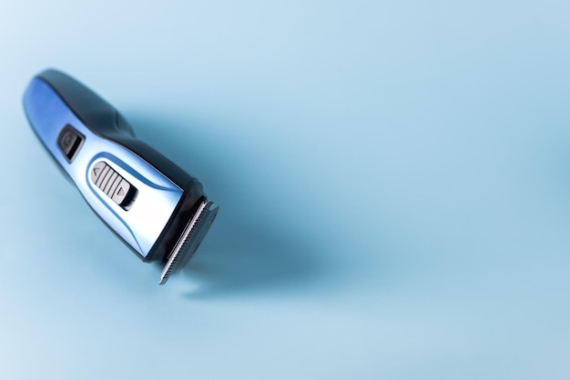 Modern Battery Electric Shaver for Man on Blue Background with Clipping Path Horizontal Copy Space