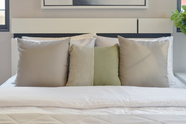 Modern bedroom interior with green and white pillow on bed