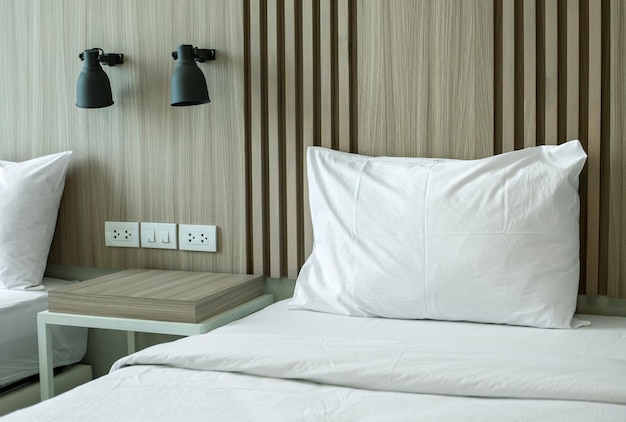 Modern bedroom interior with wall lamp and table