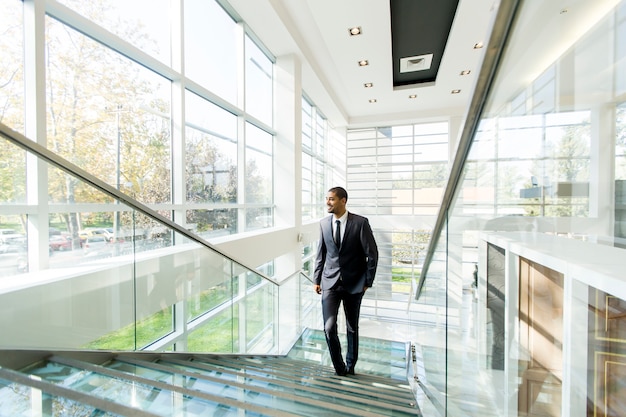 Modern black businessman on the stairs