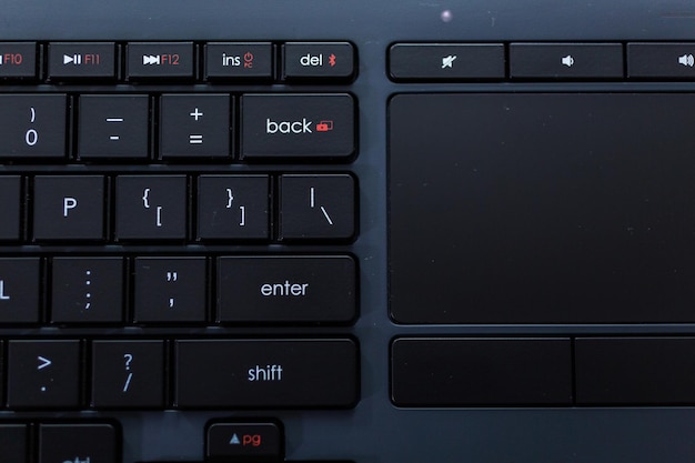 Modern black computer keyboard with flat keys.