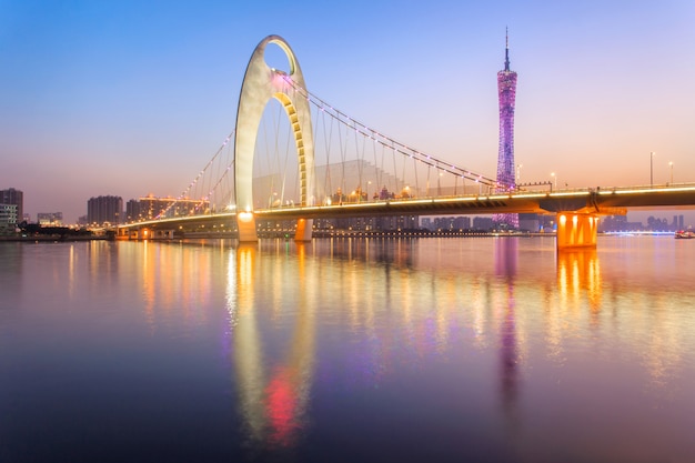 Modern bridge in Zhujiang river and modern building of financial district in guangzhou city