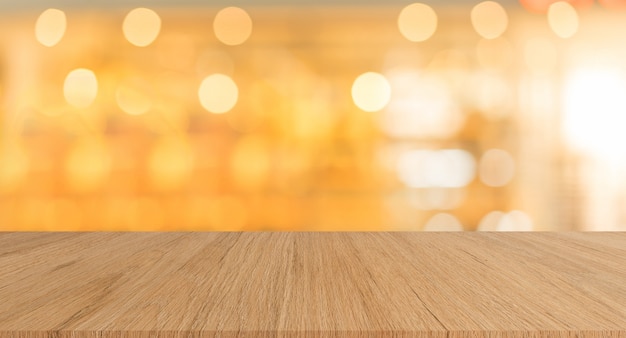 Modern brown wood tabletop with blurred restaurant bar cafe light color background