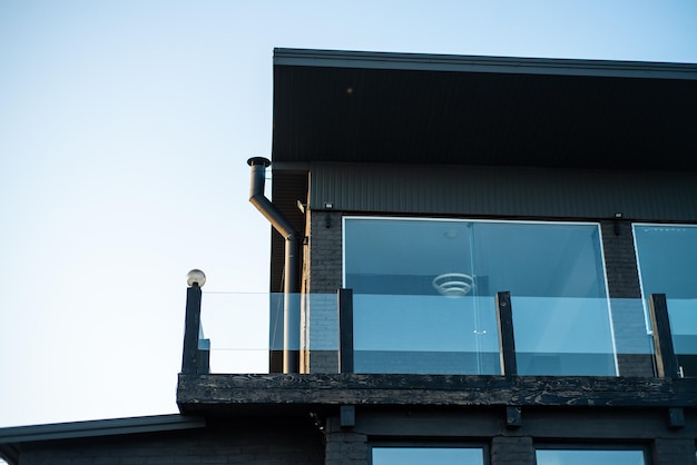 Modern building facade on village on the sunset