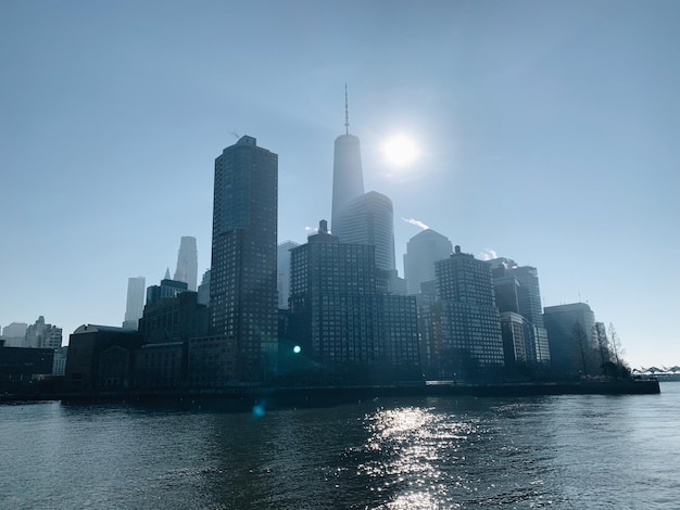 Modern buildings by city against sky