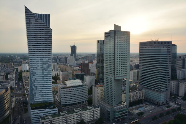 Photo modern buildings in city against sky during sunset