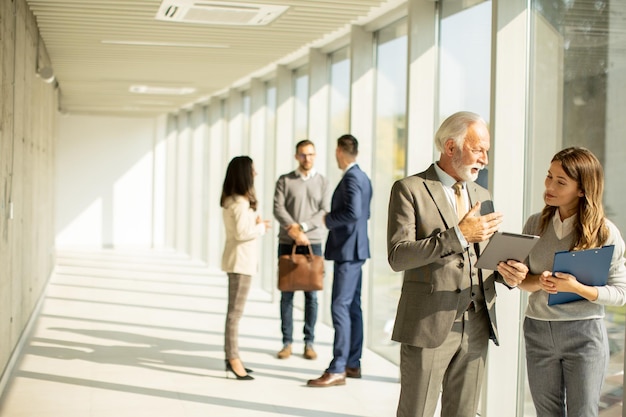 Modern business people using digital tablet in the office