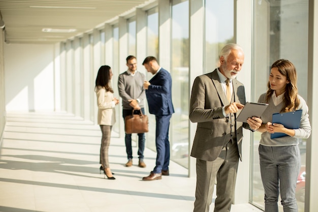 Modern business people using digital tablet in the office