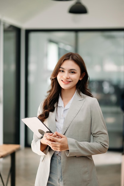 Modern business woman in the office with copy spacexA