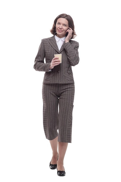 Modern business woman with a smartphone and takeaway coffee