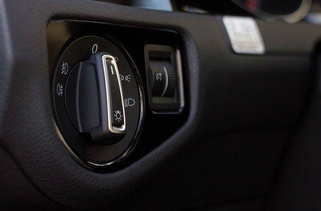 Modern car interior details with light control switch