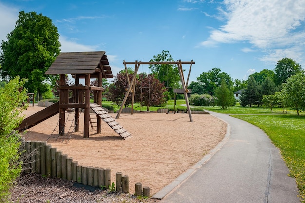 A modern children's slide made of wood and natural materials Children's playground