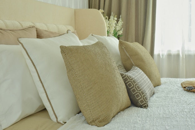 Modern classic style bedding with brown, beige and light brown pillows