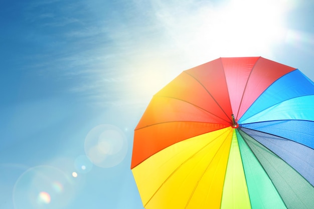 Modern color umbrella against blue sky Sun protection