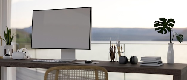 Modern contemporary home working room interior with computer on table against the glass wall