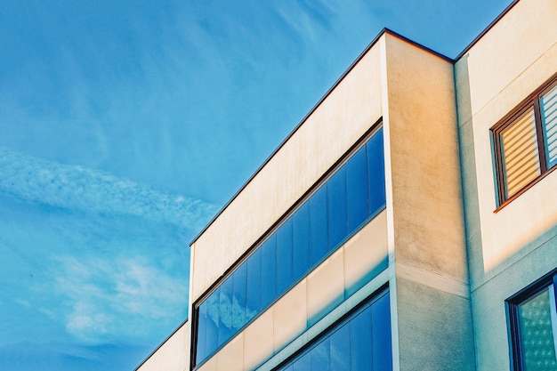 Modern corporate business office building concept. And copy space. Blue sky