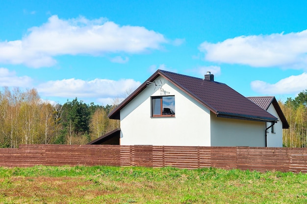 Modern cottage house with fence and small court yard. Druskininkai