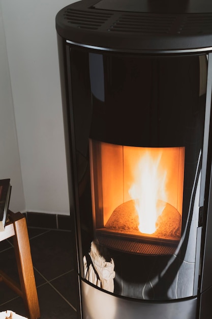 Modern domestic pellet stove granules stove with flames