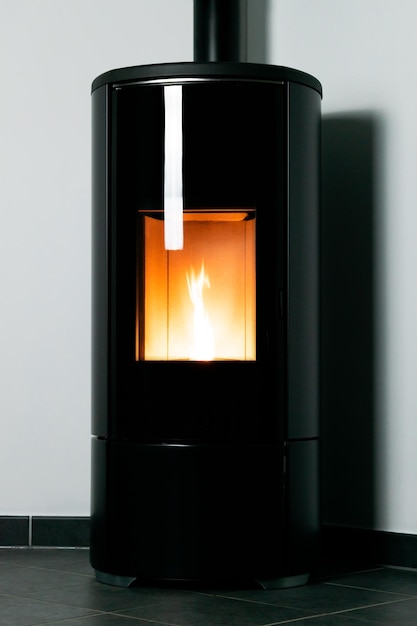 Modern domestic pellet stove granules stove with flames