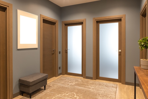 Modern entrance hallway in neutral shades of brown and gray tones.