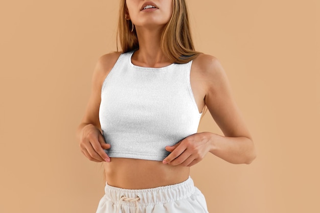 Photo modern fashion trends noface woman wears a white crop top and white shorts contemporary women s fashion with a textured white top woman wearing a stylish white top paired with a skirt