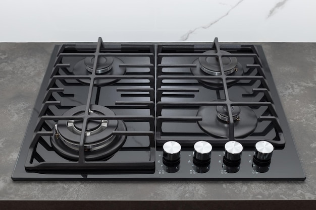 Modern gas stove top on dark countertop at home Modern kitchen appliance