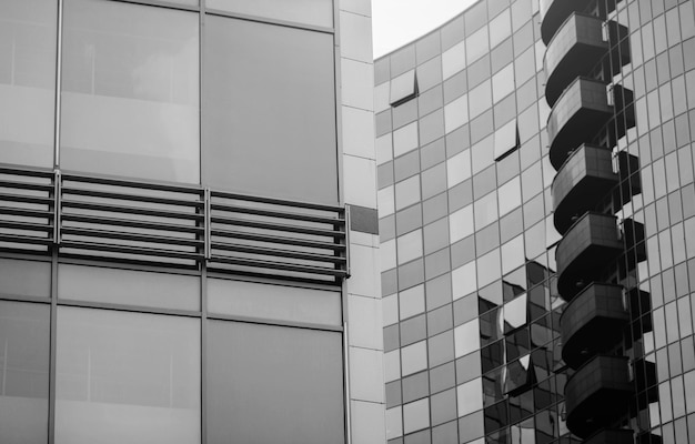 Modern glass business building with curved facade in Europe