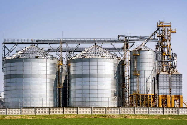 Modern Granary elevator Silver silos on agroprocessing and manufacturing plant for processing drying cleaning and storage of agricultural products flour cereals and grain seed cleaning line