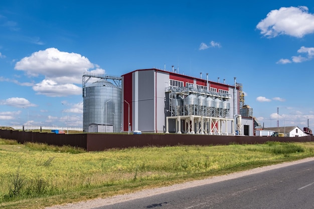 Modern Granary elevator Silver silos on agroprocessing and manufacturing plant for processing drying cleaning and storage of agricultural products flour cereals and grain