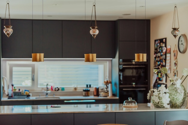 Modern gray kitchen with electronic devices and decorative items