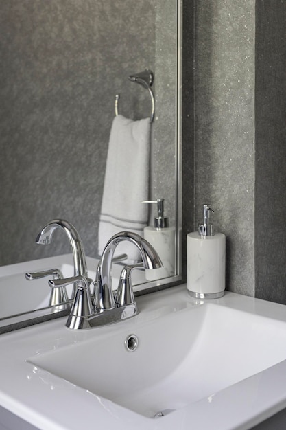 Modern Grey Powder Room Sink with Simple Accessories and Hand Towel