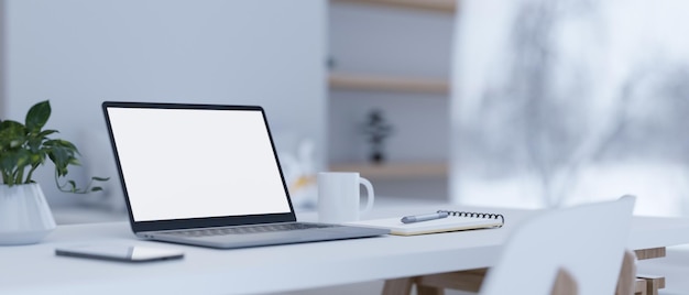 Modern home workspace with laptop mockup and stuff on white table