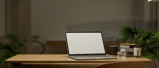 Modern home workspace with notebook laptop computer white screen mockup and copy space on table