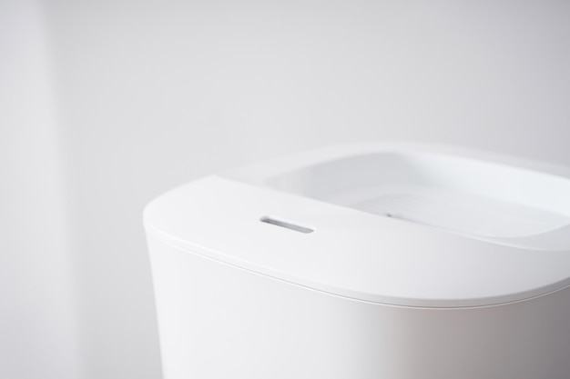 Modern humidifier on color background. Closeup.