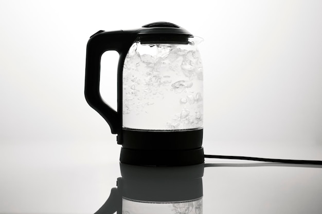 Modern kettle on white background