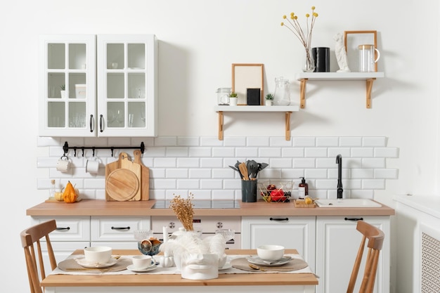 Modern kitchen interior with table setting and shelves