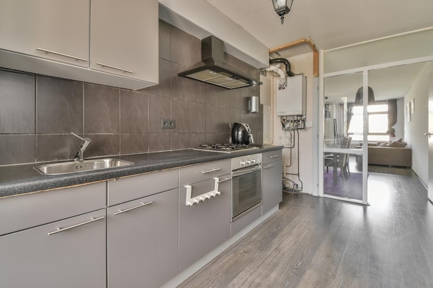 Modern kitchen near dining room in flat