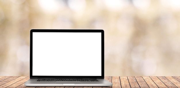 the modern laptop and coffee in the office on the window backgrounds