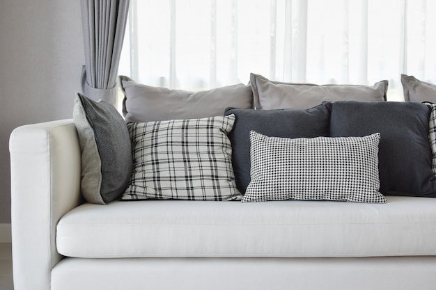 Modern living room interior with black and white checked pattern pillows on sofa