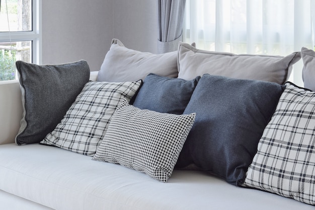 Modern living room interior with black and white checked pattern pillows on sofa