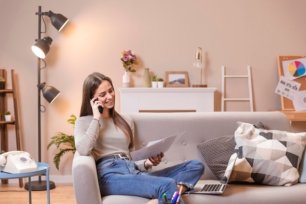 Modern living room and woman working from home