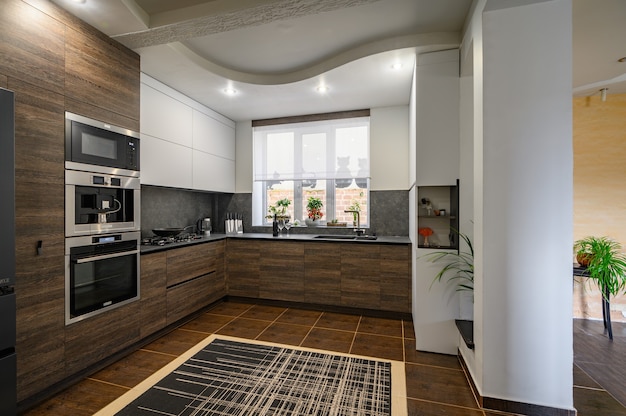 Modern luxurious dark brown, gray and black kitchen details