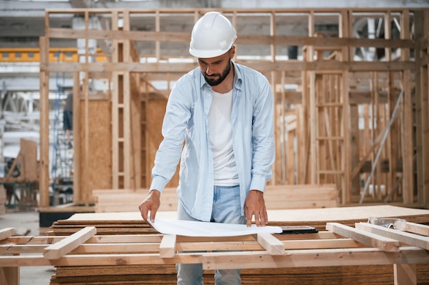 Modern manager Industrial worker in wooden warehouse