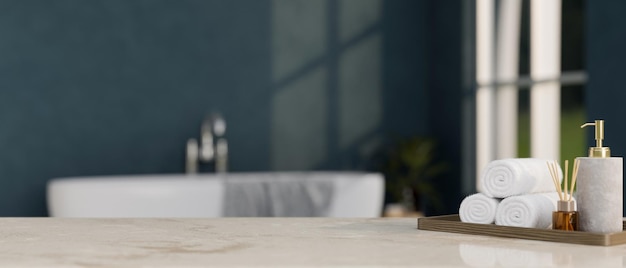 Modern marble bathroom tabletop with copy space over modern bathroom with bathtub in background