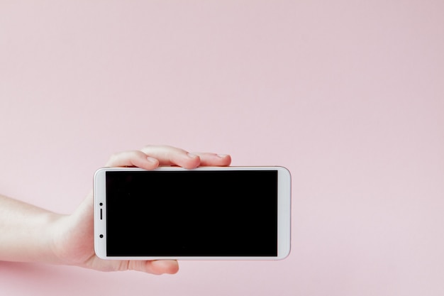 Modern mobile phone in a woman's hand