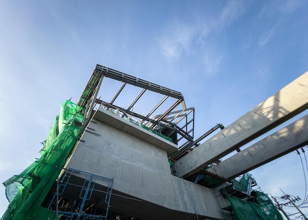 The modern monorail station is under construction near the intersection