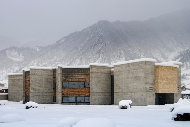 Modern museum and houses surrounded by the high mountains of the Caucasus Svaneti Georgia